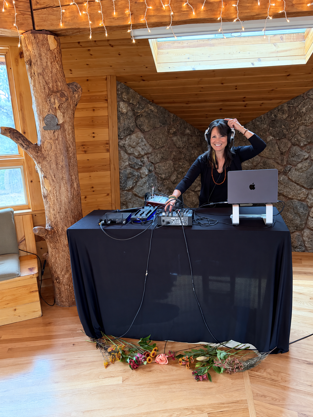 Dr. LeTa selecting music at a DJ console for a movement gathering